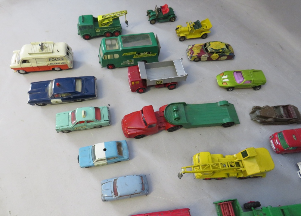 A COLLECTION OF VINTAGE PLAYWORN VEHICLES TO INCLUDE DINKY POLICE FORD TRANSIT VAN, Dinky Pontiac - Image 5 of 9