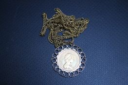 A QUEEN ELIZABETH II HALF SOVEREIGN, in an unmarked yellow metal scrolling mount suspended on an