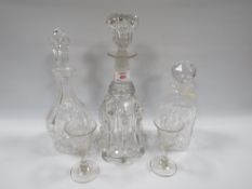 A GEORGIAN GLASS DECANTER TOGETHER WITH LATER EXAMPLES, also with two antique glasses (5)