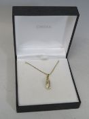 A MODERN 18CT GOLD DIAMOND SET PENDANT, suspended on a 9ct gold box chain