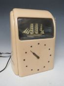 A 20TH CENTURY ART DECO STYLE VITASCOPE CLOCK, with illuminated diorama of a ship at sea, produced