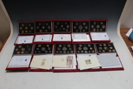 A COLLECTION OF TEN ROYAL MINT DELUXE CASED DECIMAL COIN SETS - 1990 THROUGH TO 1999