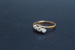 AN 18CT GOLD THREE STONE DIAMOND RING, approx weight 2.58g, ring size Q 1/2