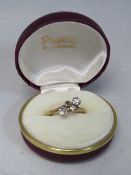 AN ANTIQUE LADIES DIAMOND RING, one stone missing, hallmarked 18ct gold