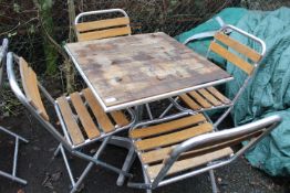 AN ALUMINIUM / HARDWOOD CAFE STYLE PATIO / GARDEN TABLE SET WITH FOUR FOLDING CHAIRS