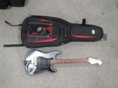 AN ELECTRIC GUITAR WITH THREE SILVER COIL PICK-UPS , FITTED WITH A ROLAND GK 