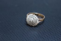 A HALLMARKED 9 CARAT GOLD DIAMOND CLUSTER RING, set with an estimated half carat of diamonds, approx