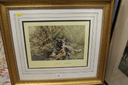 A SIGNED LIMITED EDITION GILT FRAMED AND GLAZED DAVID SHEPHERD PRINT OF A TIGER CUB ENTITLED TEENAGE