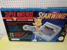 A VINTAGE SUPER NINTENDO GAMES SYSTEM , PAL VERSION IN ORIGINAL BOX (UNCHECKED)