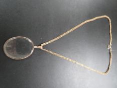 A HALLMARKED 9 CARAT GOLD PENDANT MOUNT WITH CRYSTAL TOGETHER WITH A UNMARKED YELLOW METAL CHAIN