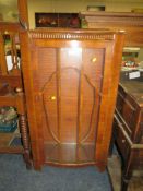 A VINTAGE WALNUT CHINA CABINET