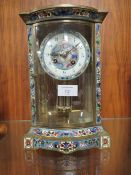 A ENAMELLED BRASS AND GLASS MERCURY WEIGHTED DOWN MANTLE CLOCK