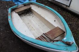 A FIBREGLASS ROWING BOAT