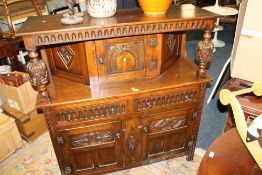 AN OAK CARVED COURT CUPBOARD W-130 CM