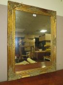 A MODERN GILT FRAMED RECTANGULAR MIRROR 65 X 84 CM