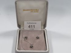 A HALLMARKED 9CT WHITE GOLD SAPPHIRE AND DIAMOND NECKLACE AND EARRINGS