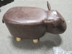 AN ANIMAL FOOT STOOL
