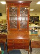 A 20TH CENTURY BUREAU / BOOKCASE A/F Condition Report:Crack to the fall front