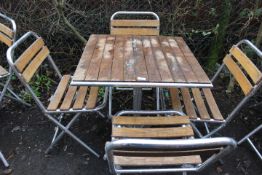 AN ALUMINIUM / HARDWOOD CAFE STYLE PATIO / GARDEN TABLE SET WITH FOUR FOLDING CHAIRS
