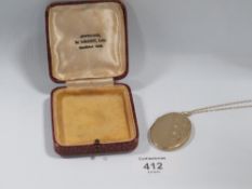 A 9CT GOLD BACK AND FRONT LOCKET ON 9CT GOLD CHAIN 13G