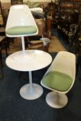 A RETRO WHITE PLASTIC TABLE AND TWO CHAIRS