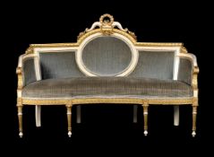 A WHITE PAINTED AND PARCEL GILT CANAPÉ