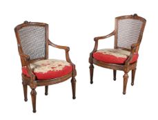 A PAIR OF NORTH ITALIAN CARVED WALNUT ARMCHAIRS