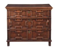 A CHARLES II OAK CHEST OF DRAWERS