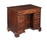 A GEORGE III MAHOGANY KNEEHOLE DESK