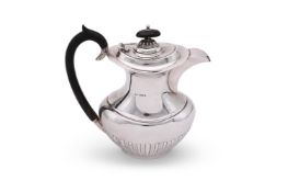 A VICTORIAN SILVER HALF LOBED OVAL HOT WATER POT