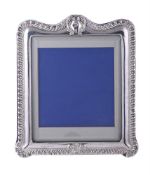A VICTORIAN SILVER MOUNTED SHAPED RECTANGULAR PHOTO FRAME