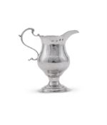 A GEORGE III SILVER CREAM JUG