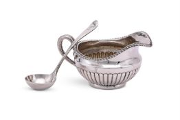 A GEORGE III SILVER CREAM JUG