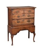 A WALNUT CHEST ON STAND