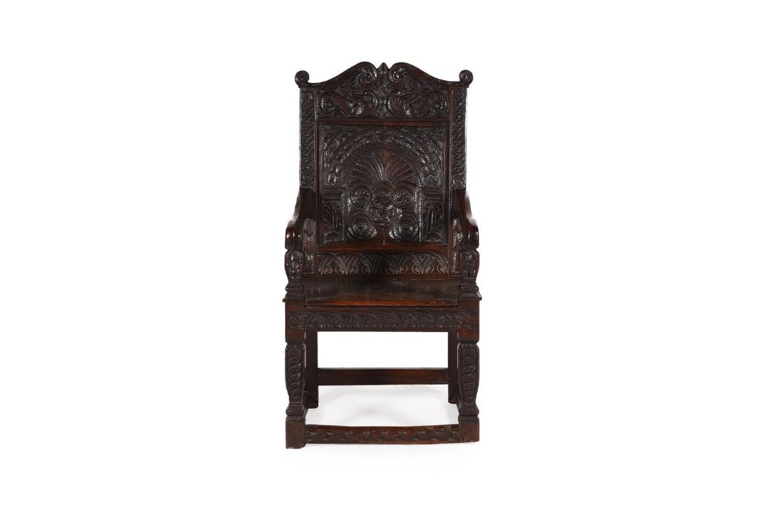 A CARVED OAK WAINSCOT ARMCHAIR - Image 1 of 3
