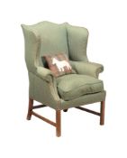 A WING ARMCHAIR IN GEORGE III STYLE