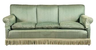 A GREEN UPHOLSTERED THREE SEAT SOFA