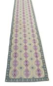 A LARGE CONTINENTAL WOVEN GALERY CARPET PROBABLY PORTUGUESE