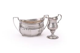 A GEORGE III SILVER OVAL TWIN HANDLED SUGAR BOWL