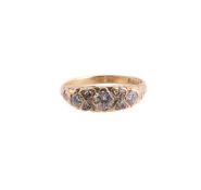 A SEVEN STONE DIAMOND RING, LONDON 1962