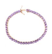 AN AMETHYST TENNIS LINE BRACELET