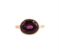 A SINGLE STONE GARNET RING, LONDON 2018