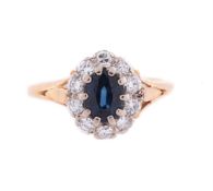 A SAPPHIRE AND DIAMOND CLUSTER RING
