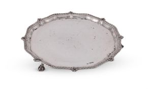 A SILVER SHAPED CIRCULAR SALVER