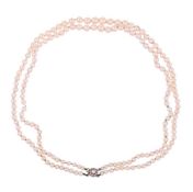 A TWO ROW CULTURED PEARL NECKLACE TO A DIAMOND AND PEARL CLASP