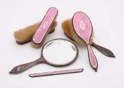 A SILVER MOUNTED AND PINK ENAMEL SIX PIECE DRESSING TABLE SET