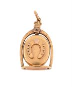 A VICTORIAN GOLD HORSESHOE AND STIRRUP LOCKET, CIRCA 1850