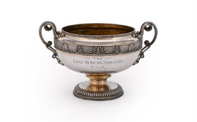A SILVER TWIN HANDLED PEDESTAL BOWL