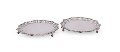 A PAIR OF SILVER SHAPED CIRCULAR WAITERS
