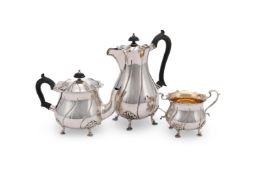 AN EDWARDIAN SILVER BALUSTER TEA POT AND TWIN HANDLED SUGAR BOWL